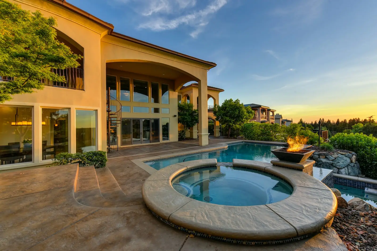 Mediterranean-style home with a tile roof