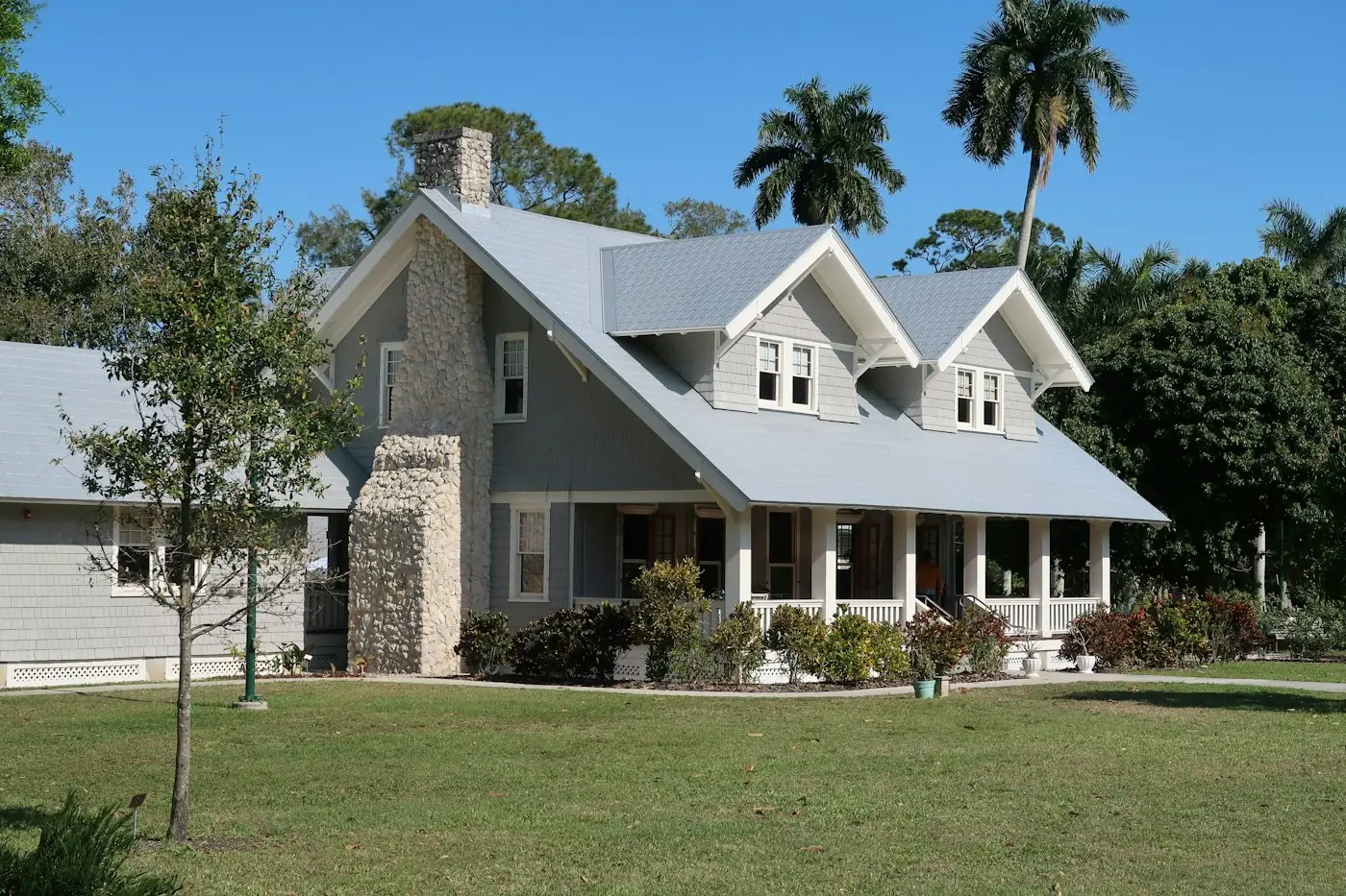 Valley home with palm trees and a pitched roof