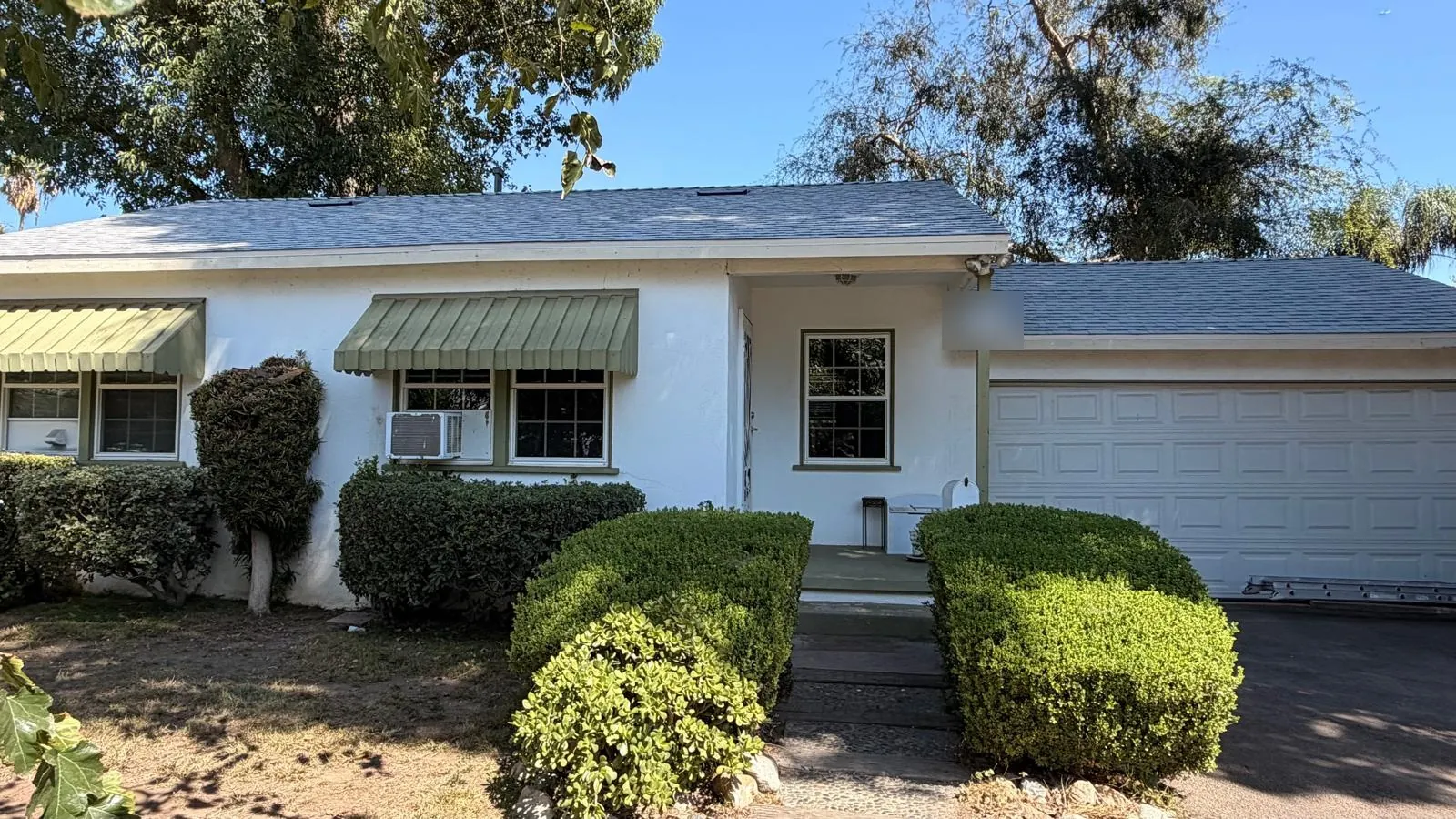 Single-story Northridge home after a cool roof shingle replacement with Owens Corning Shasta White