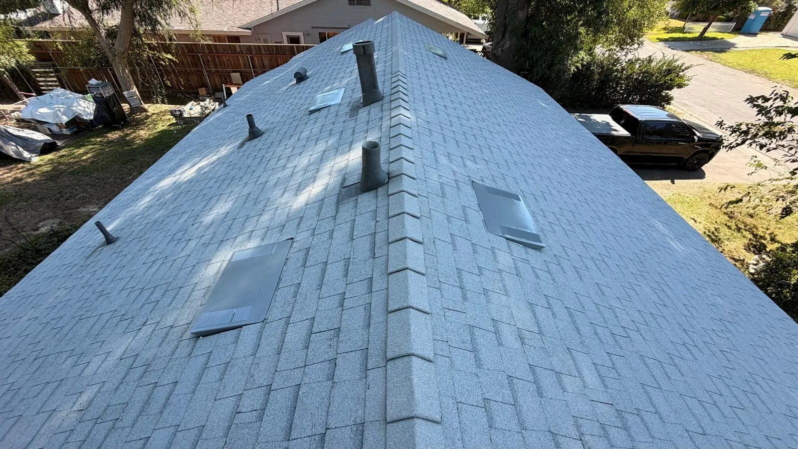 Ridge cap and roof penetrations on a new Shasta White shingle roof in Northridge