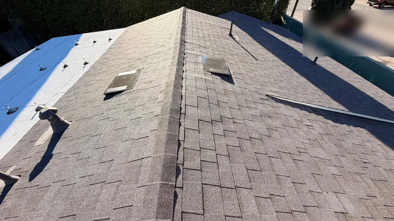 Ridge line of new Midnight cool roof shingles on an Encino home