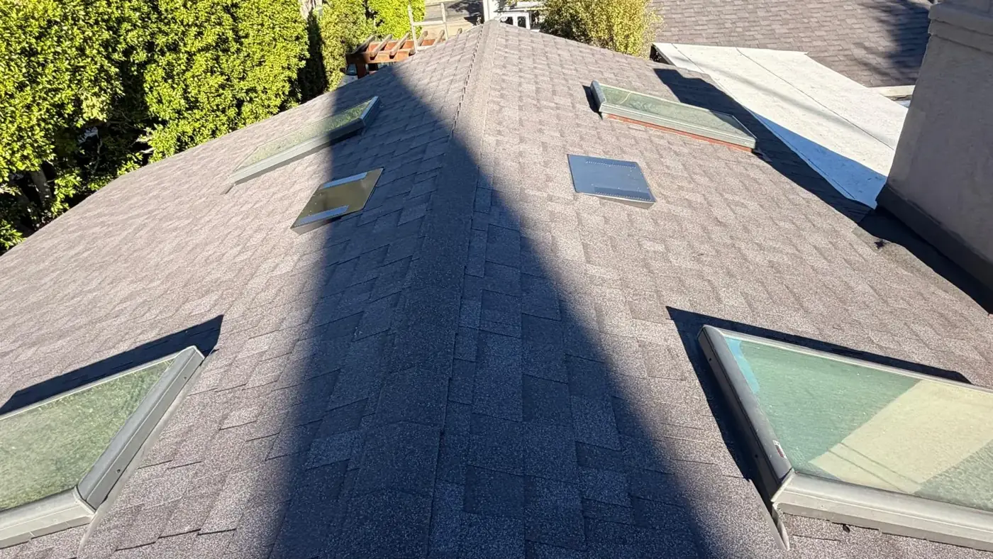 Hip roof with new Midnight cool roof shingles and several skylights on an Encino home