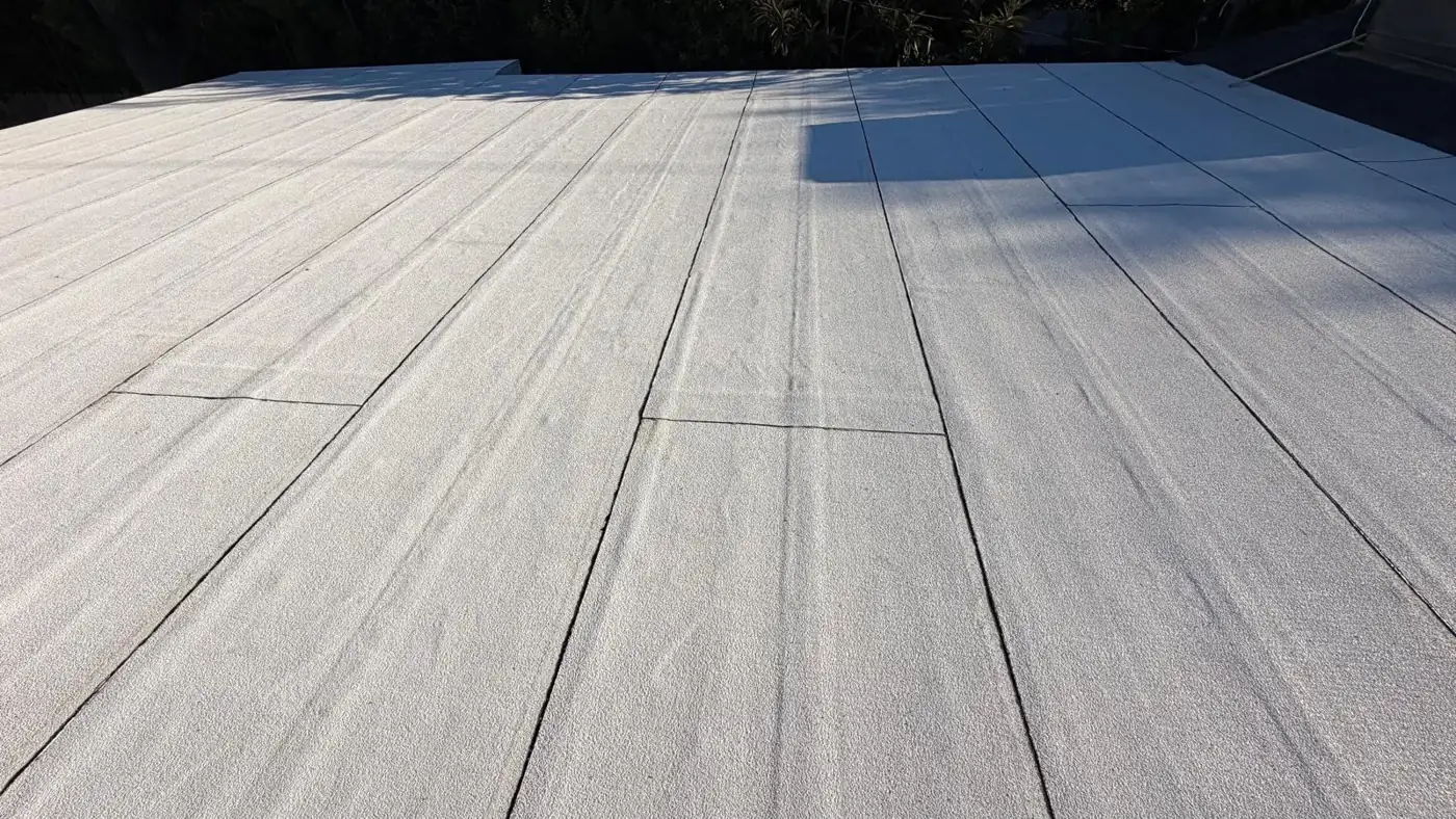 White PolyFresko torch-down cap sheet on a flat roof section of an Encino home