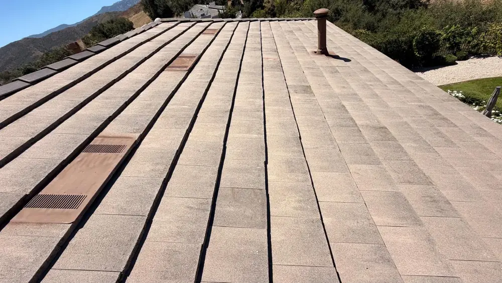 Finished concrete flat tile slope with roof vents on the Agoura Hills re-felt